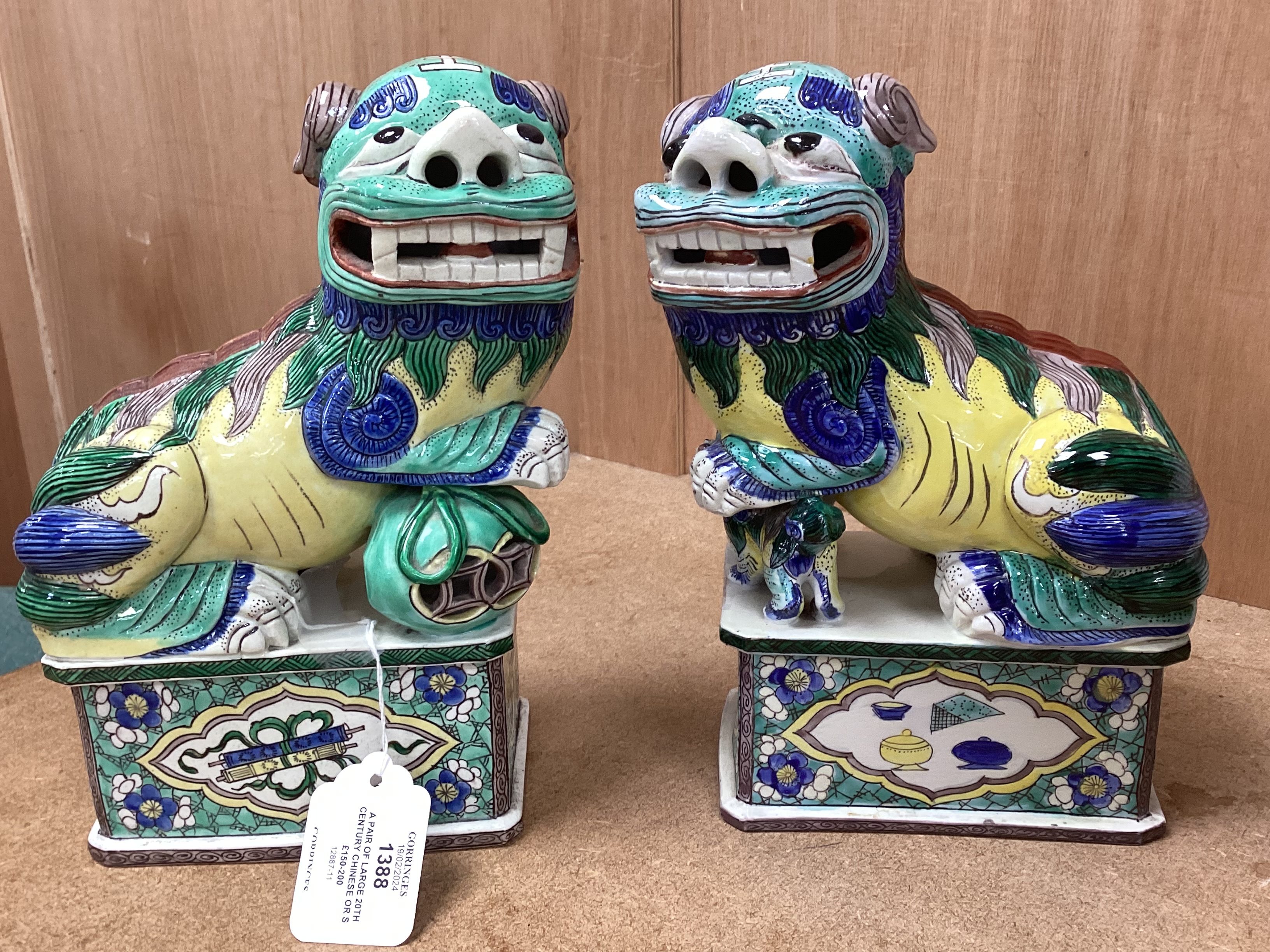 A pair of large 20th century Chinese or Samson enamelled porcelain figures of Buddhist Lions, 24cm